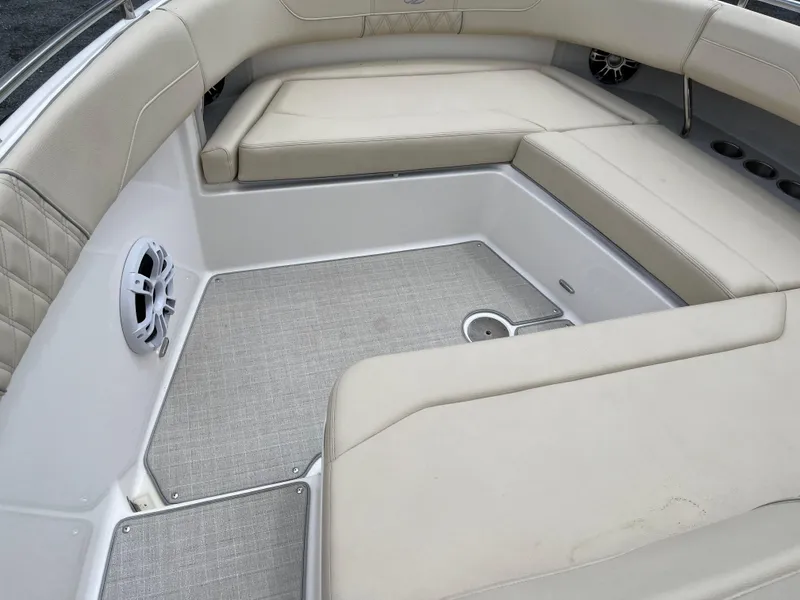 Slide: The Image of Luxurious seating area on a 2022 Regal 33 SAV boat with beige upholstery. - 23