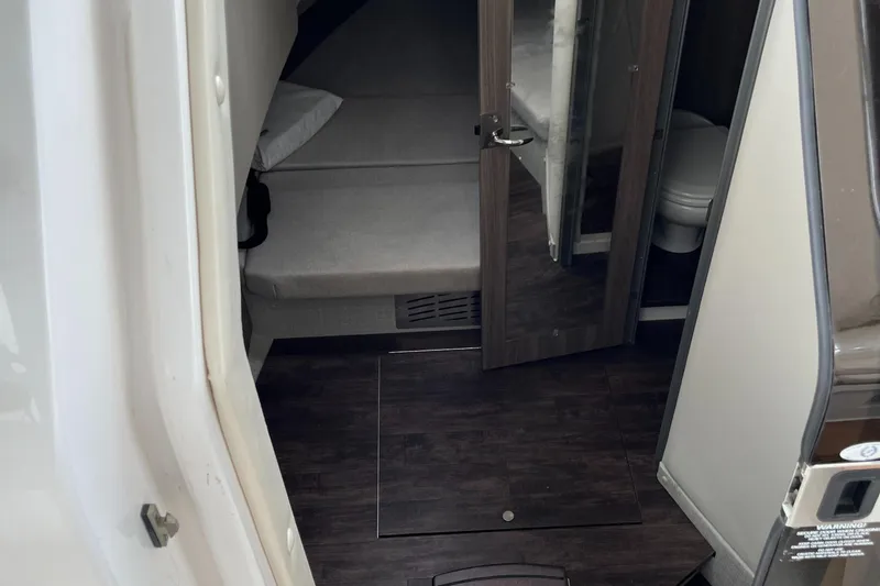 Slide: The Image of Interior cabin of 2022 Regal 33 SAV boat with bed and bathroom. - 25