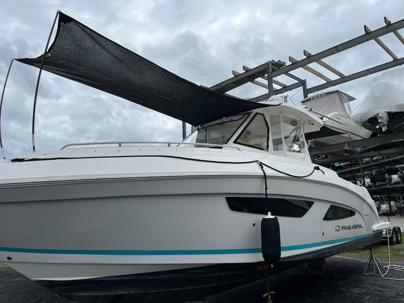 Slide: The Image of 2022 Regal 33 SAV boat on display, featuring sleek design and modern features. - 32