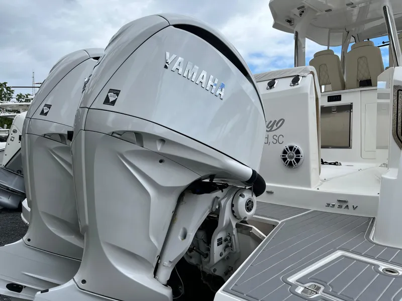 Slide: The Image of 2022 Regal 33 SAV boat with Yamaha outboard engines, featuring sleek design and spacious deck. - 37