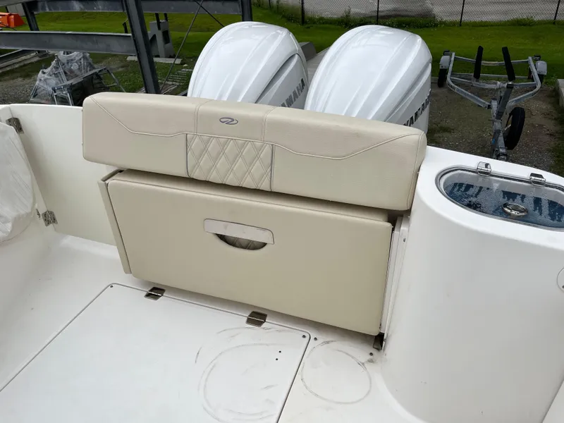 Slide: The Image of 2022 Regal 33 SAV boat with dual engines and beige seating. - 6
