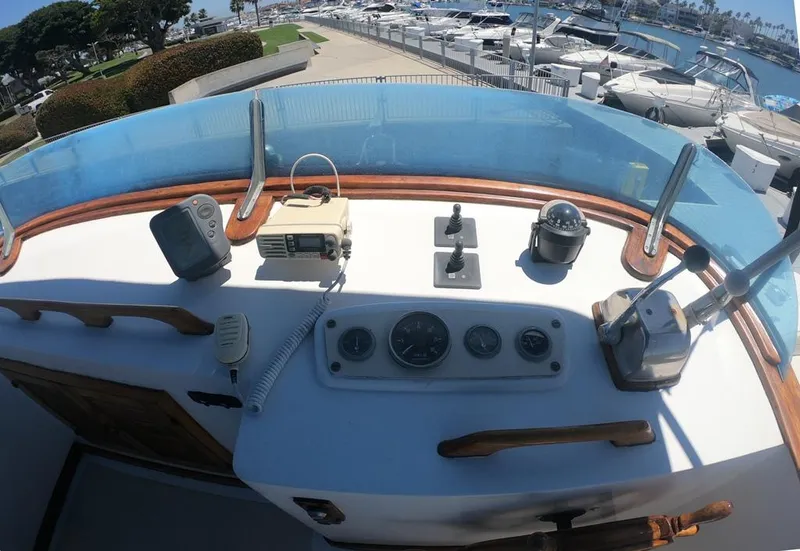 Slide: The Image of 1977 CHB 34 boat helm with navigation instruments docked at marina. - 12