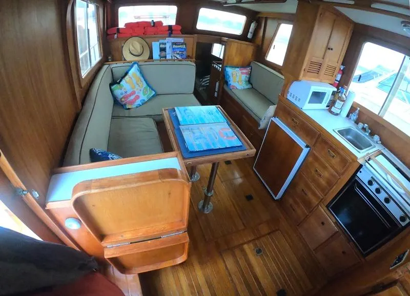 Slide: The Image of Interior of 1977 CHB 34 boat with wooden furnishings and kitchen area. - 23