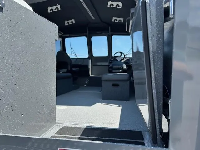 Slide: The Image of Interior of 2025 Spartan 220 Maximus Pro boat, showcasing modern seating and controls. - 6