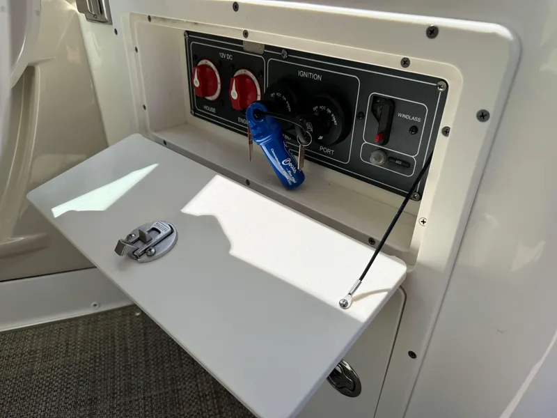 Slide: The Image of Control panel of a 2017 Boston Whaler 320 Vantage boat with ignition keys. - 17