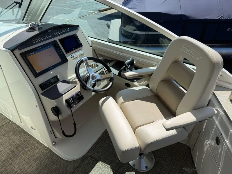 Slide: The Image of 2017 Boston Whaler 320 Vantage helm with dual screens and comfortable captain's chair. - 23