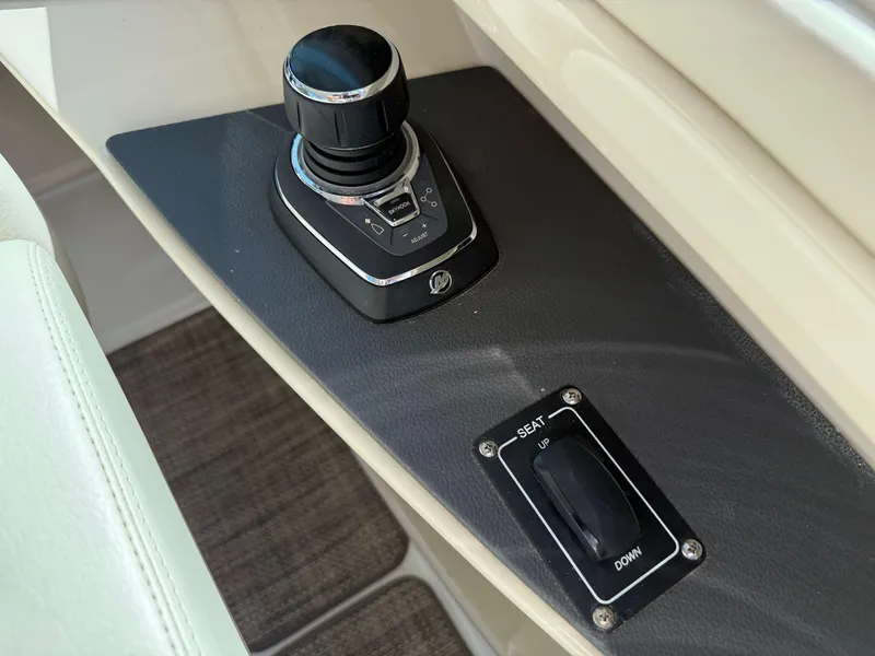 Slide: The Image of Control panel of 2017 Boston Whaler 320 Vantage with joystick and seat adjustment switch. - 26