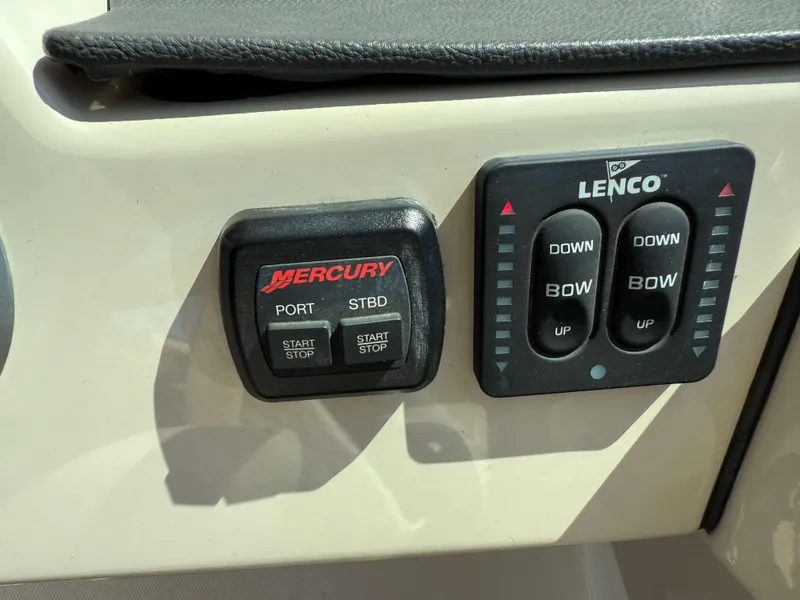 Slide: The Image of Control panel of a 2017 Boston Whaler 320 Vantage boat with Mercury and Lenco switches. - 31