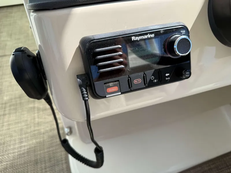 Slide: The Image of Raymarine control panel on 2017 Boston Whaler 320 Vantage boat dashboard. - 32