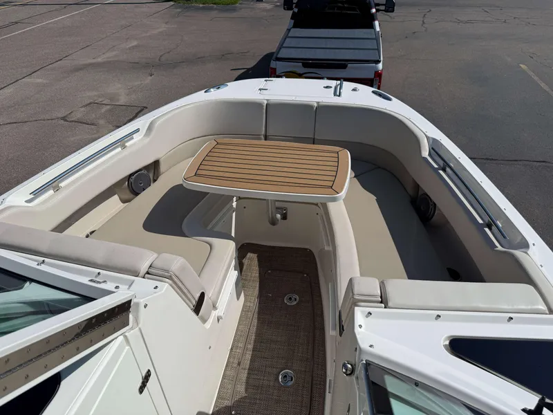 Slide: The Image of 2017 Boston Whaler 320 Vantage boat interior with seating and table. - 40