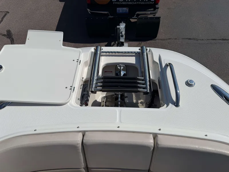 Slide: The Image of 2017 Boston Whaler 320 Vantage boat with open storage compartment and ladder. - 43