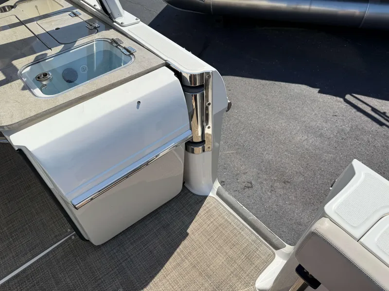 Slide: The Image of 2017 Boston Whaler 320 Vantage boat interior with storage and seating area. - 44