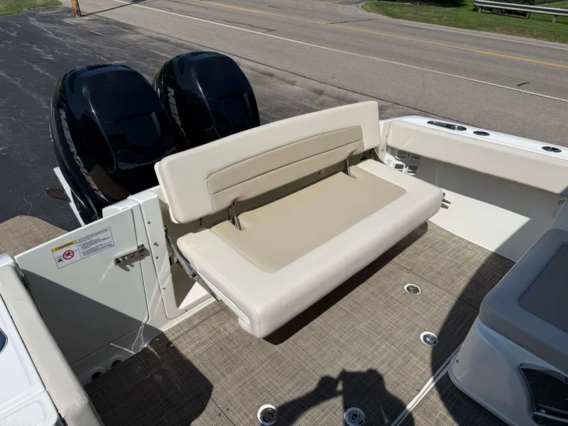 Slide: The Image of 2017 Boston Whaler 320 Vantage boat with dual engines and foldable seating. - 7