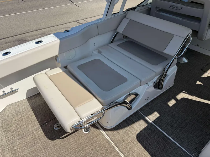 Slide: The Image of 2017 Boston Whaler 320 Vantage boat interior seating with adjustable lounge. - 9