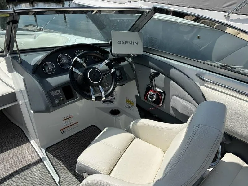 Slide: The Image of 2019 Cobalt 220S boat interior with Garmin navigation system and sleek steering wheel. - 12