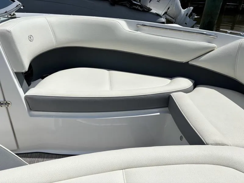 Slide: The Image of 2019 Cobalt 220S boat interior with white and gray seating. - 17