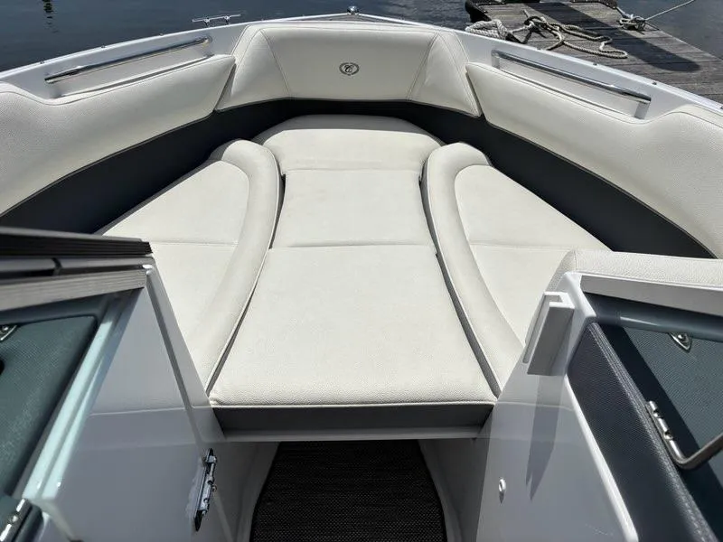 Slide: The Image of 2019 Cobalt 220S boat interior with spacious, cushioned seating area. - 20