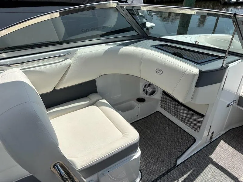 Slide: The Image of 2019 Cobalt 220S boat interior with white seating and sleek design. - 21