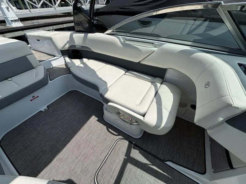 Slide: The Image of 2019 Cobalt 220S boat interior with sleek white seating and modern design. - 22