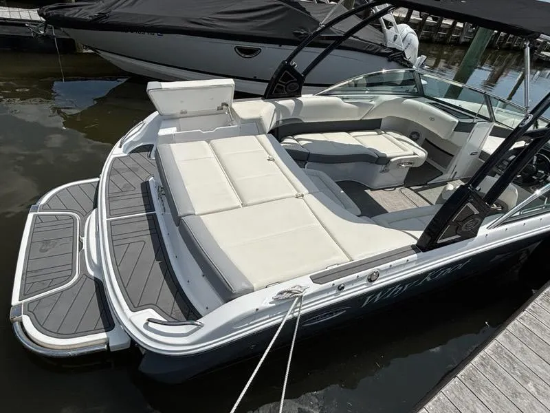 Slide: The Image of 2019 Cobalt 220S boat with spacious seating and sleek design docked at marina. - 28