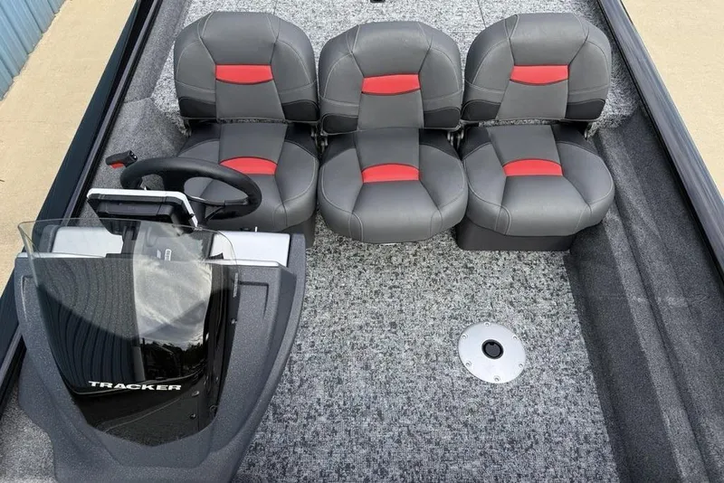Slide: The Image of 2026 Tracker Pro Team 175 Crappie Edition boat interior with four seats and steering console. - 13