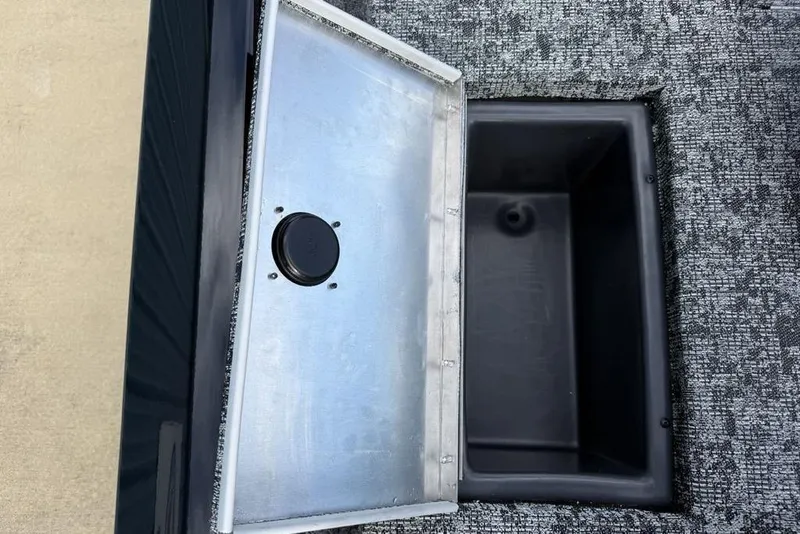 Slide: The Image of 2026 Tracker Pro Team 175 Crappie Edition boat storage compartment, open lid view. - 19