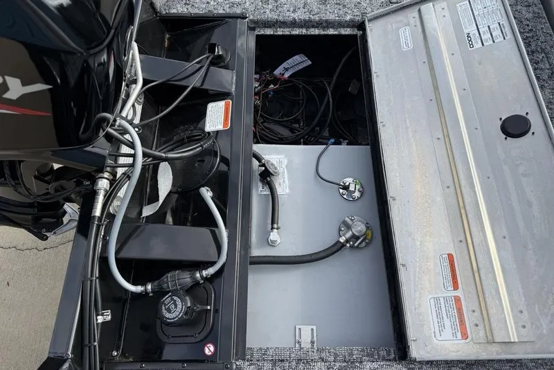 Slide: The Image of Open engine compartment of 2026 Tracker Pro Team 175 Crappie Edition boat. - 21