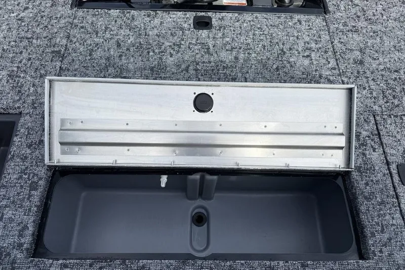 Slide: The Image of 2026 Tracker Pro Team 175 Crappie Edition boat storage compartment, open view. - 22