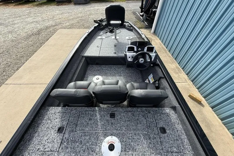 Slide: The Image of 2026 Tracker Pro Team 175 Crappie Edition boat interior with seating and steering console. - 23