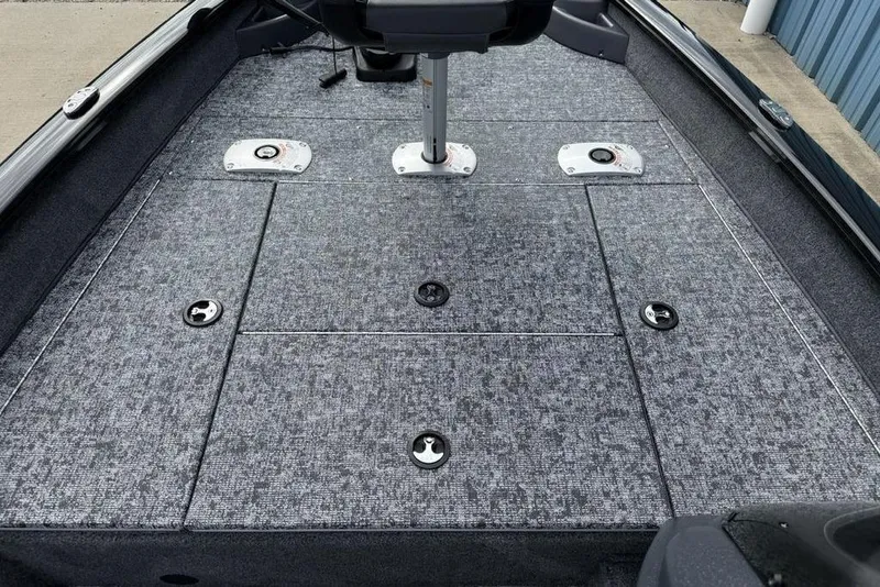 Slide: The Image of 2026 Tracker Pro Team 175 Crappie Edition boat deck with storage compartments. - 8