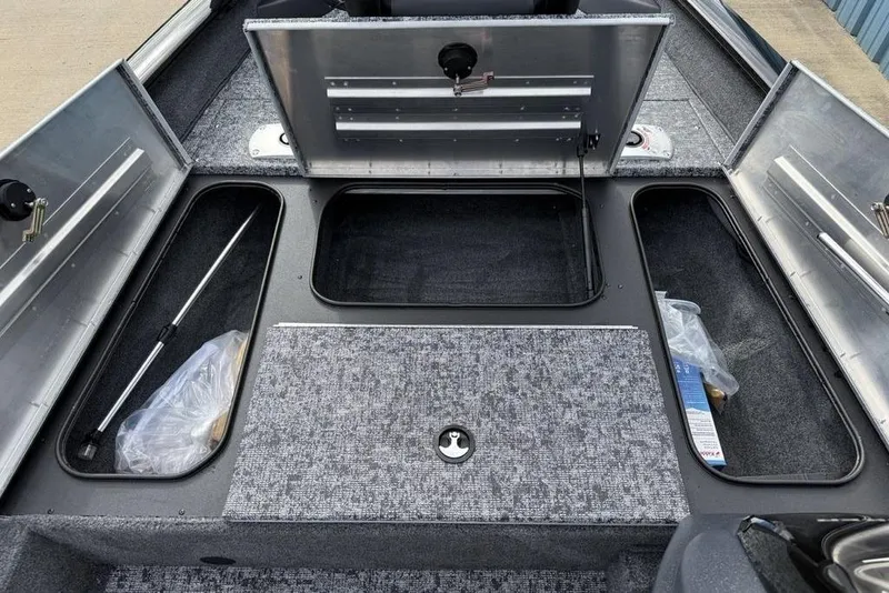 Slide: The Image of 2026 Tracker Pro Team 175 Crappie Edition boat storage compartments open, showcasing interior space. - 9