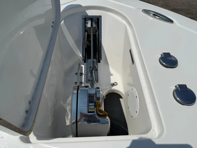Slide: The Image of 2018 Tidewater 232 LXF boat anchor compartment with stainless steel fittings. - 17