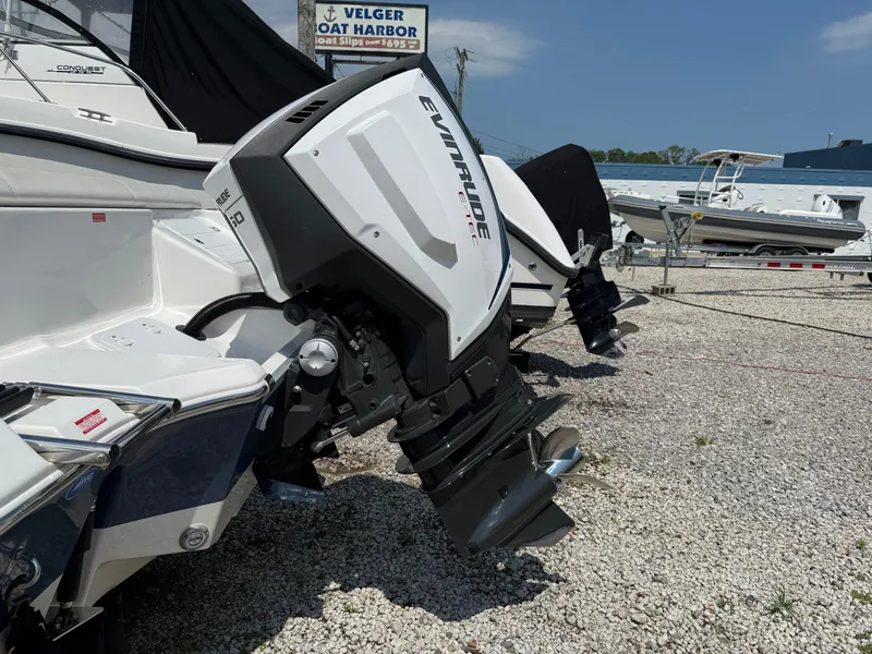 Slide: The Image of 2018 Tidewater 232 LXF boat with Evinrude outboard motor at Velger Boat Harbor. - 2