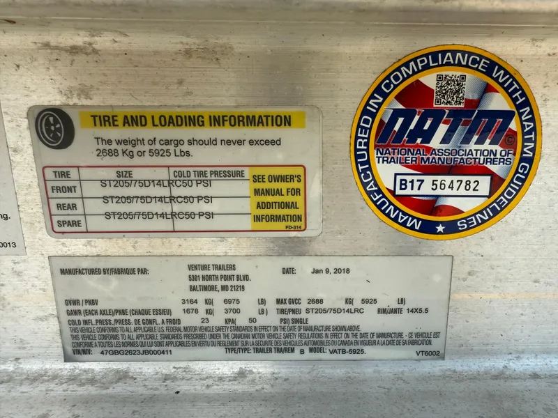 Slide: The Image of Tire and loading information label on a 2018 Tidewater 232 LXF trailer. - 23
