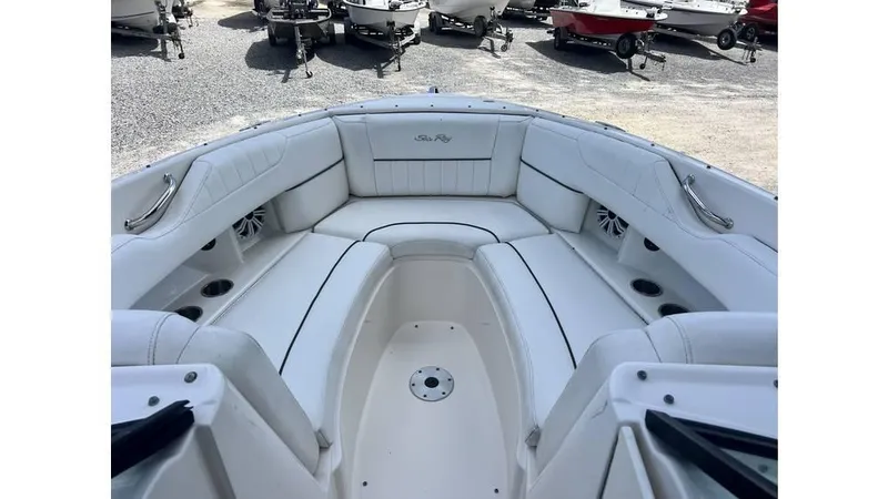 Slide: The Image of 2008 Sea Ray 270SLX boat interior with white seating and cup holders. - 2
