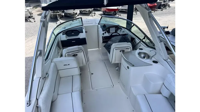 Slide: The Image of Interior of a 2008 Sea Ray 270SLX boat with white seating and helm. - 3