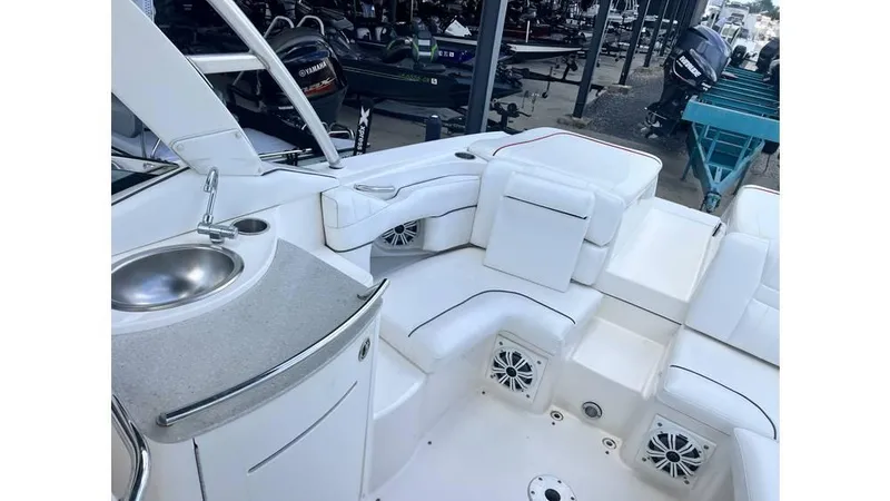 Slide: The Image of 2008 Sea Ray 270SLX boat interior with white seating and built-in sink. - 5