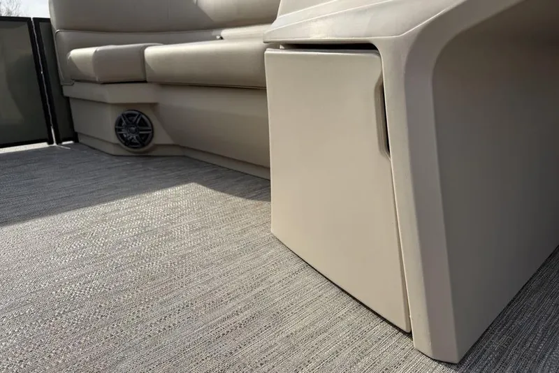 Slide: The Image of Interior of 2025 Godfrey Xperience 2286 SBX pontoon boat, featuring seating and speaker. - 10