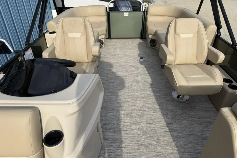 Slide: The Image of 2025 Godfrey Xperience 2286 SBX pontoon boat interior with beige seating and modern design. - 13