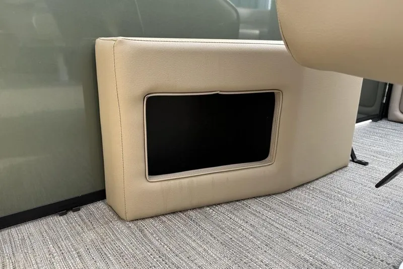 Slide: The Image of Beige interior detail of 2025 Godfrey Xperience 2286 SBX boat, featuring storage compartment. - 25