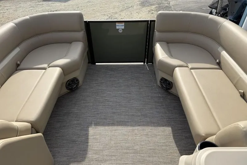 Slide: The Image of 2025 Godfrey Xperience 2286 SBX pontoon boat interior with beige seating and carpet flooring. - 5