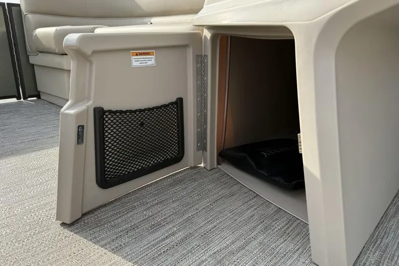 Slide: The Image of Open storage compartment on 2025 Godfrey Xperience 2286 SBX pontoon boat. - 9
