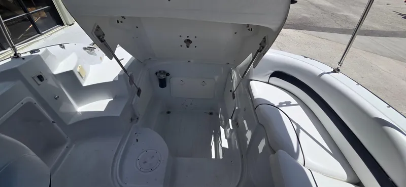 Slide: The Image of 2011 SouthWind 2200 SD boat interior with open storage compartment and seating area. - 11