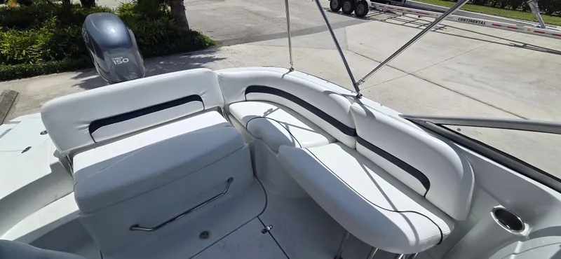 Slide: The Image of 2011 SouthWind 2200 SD boat interior with white seating and Yamaha 150 engine. - 12