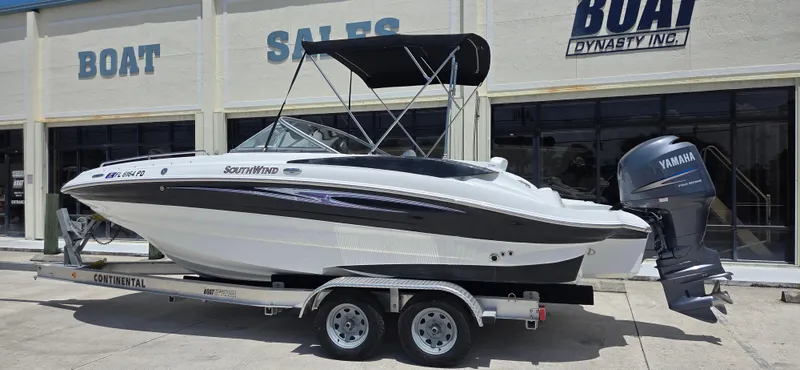 Slide: The Image of 2011 SouthWind 2200 SD boat on trailer, parked outside a boat sales shop. - 3