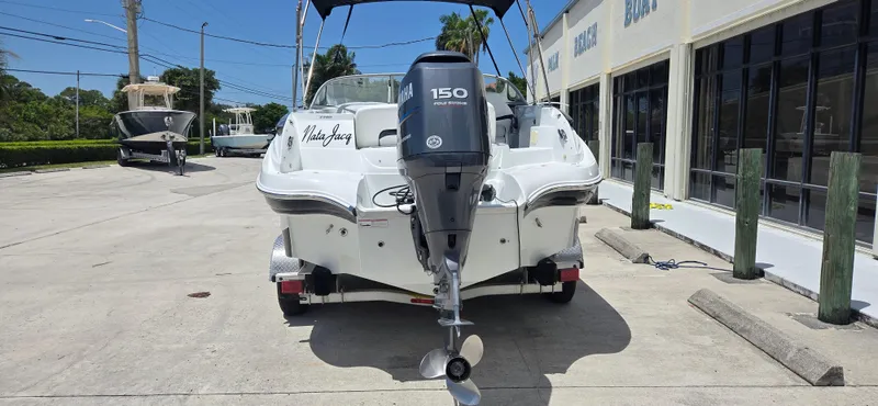 Slide: The Image of 2011 SouthWind 2200 SD boat with Yamaha 150 engine, parked outdoors. - 4