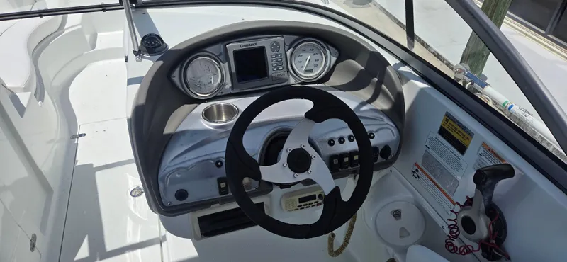 Slide: The Image of 2011 SouthWind 2200 SD boat dashboard with steering wheel and gauges. - 6