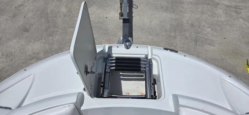 Slide: The Image of 2011 SouthWind 2200 SD boat with open hatch and retractable ladder on deck. - 9