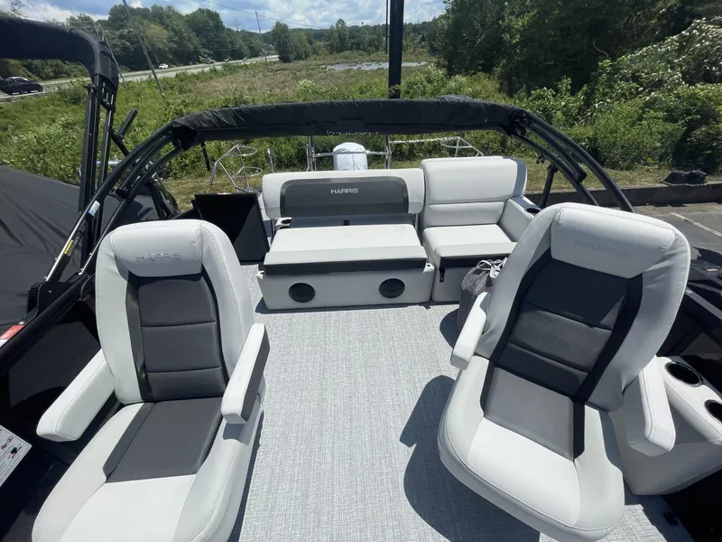 Slide: The Image of 2026 Harris Cruiser 210 boat interior with plush seating and modern design. - 11