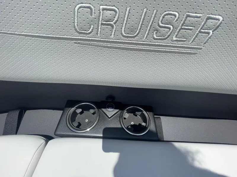 Slide: The Image of 2026 Harris Cruiser 210 interior with embossed logo and dual cup holders. - 4